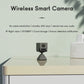 Small wireless smart camera on tabletop stand, black with front lens