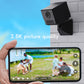 Black wireless action camera with wall bracket, beside a live video phone view