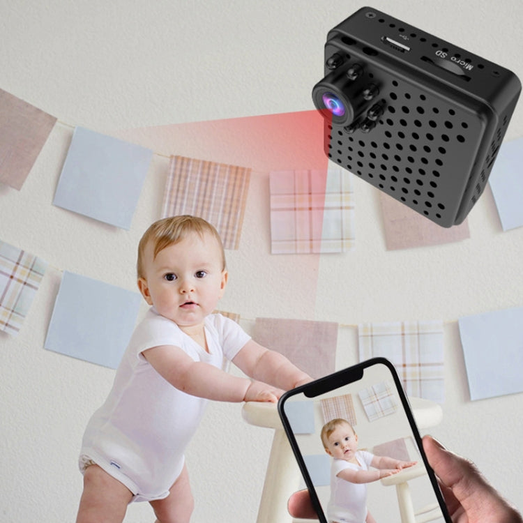 Mini WiFi security camera cube with purple lens, held alongside a smartphone preview