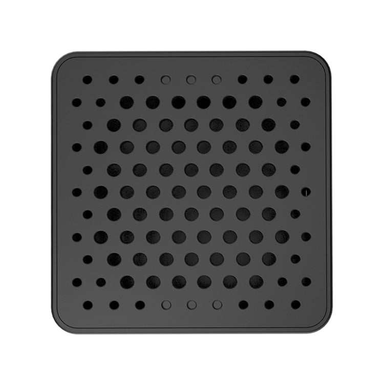 Black mini security camera back panel with grid of ventilation holes
