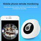 White dome security camera next to smartphone remote monitoring view