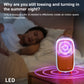Orange mosquito killer with glowing purple LED circle on a bedside surface