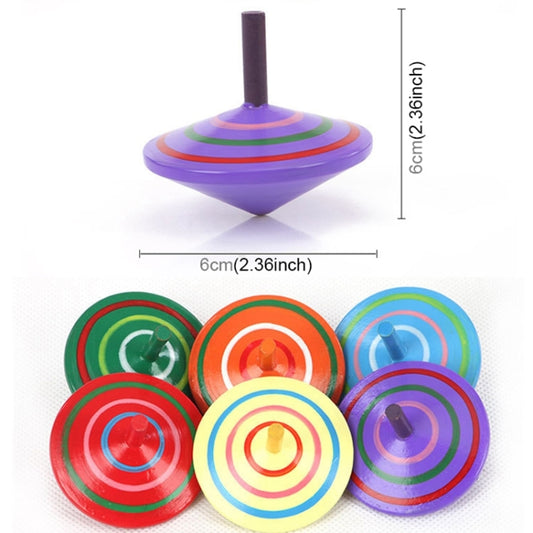 Purple wooden rotating gyro top with concentric rings; assorted colorful tops shown