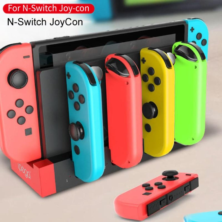 Charging dock stand with multiple Joy-Con slots, holding four controllers