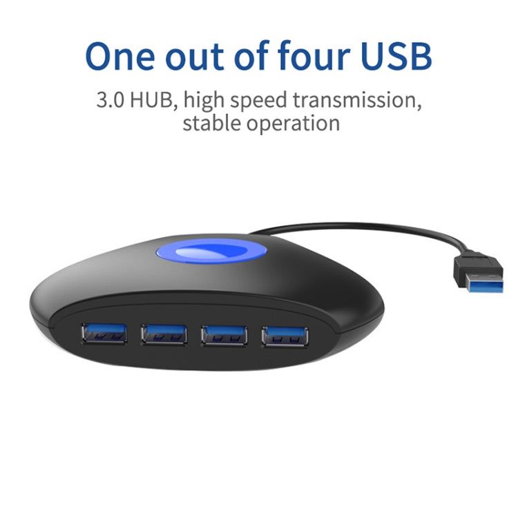 Black desktop USB hub with blue LED and four USB ports