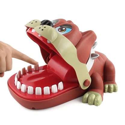 Dog-shaped novelty bite toy with open red mouth and cream jaw, showing white teeth.