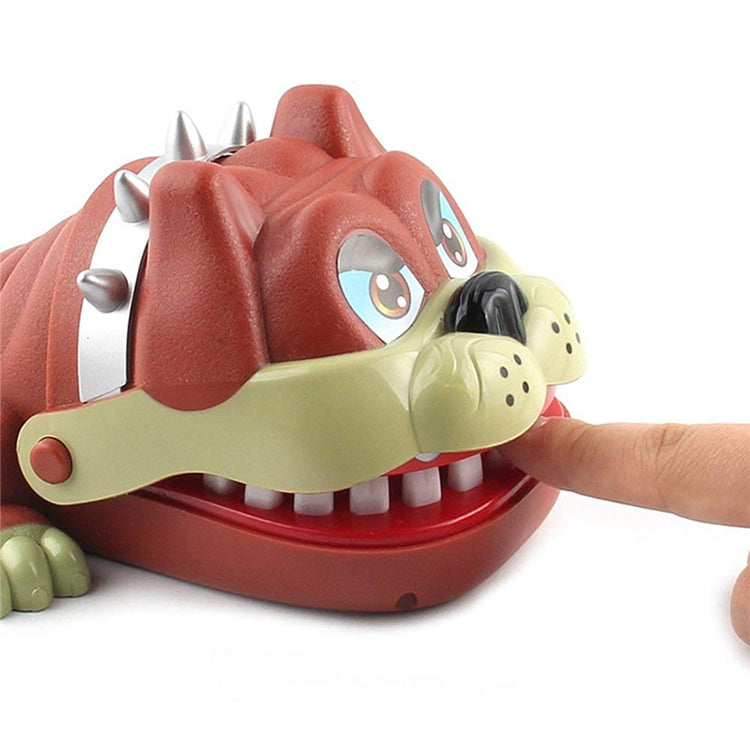 Dog bite toy close-up with cream jaw plate, silver spikes, and visible white fangs.