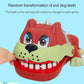 Dog-shaped bite toy with open mouth and white teeth, hand pressing the side.