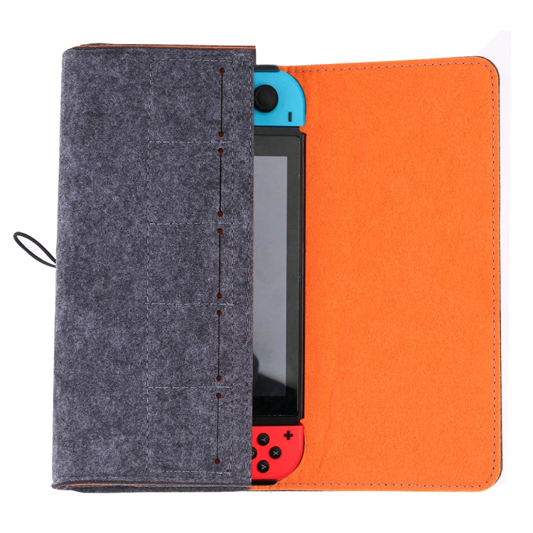Felt console case with dark gray outer flap and orange interior, open view