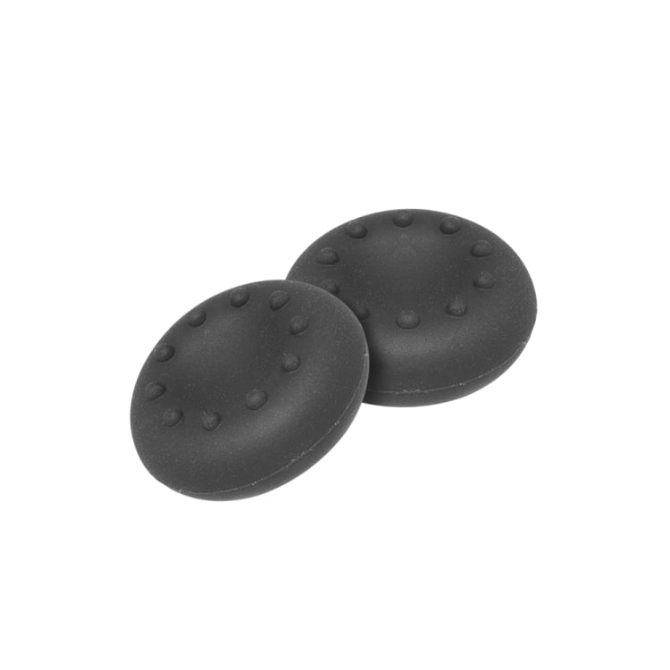 Two black oval thumb caps with grip bumps, analog cap kit