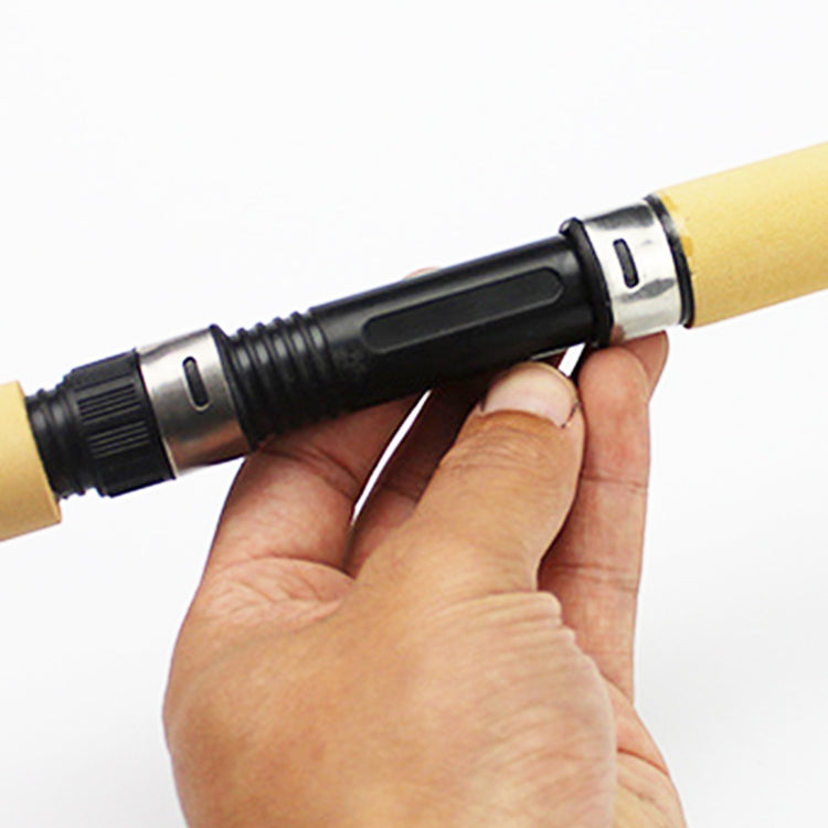 Ice fishing rod handle close-up with black grip rings and metal connector