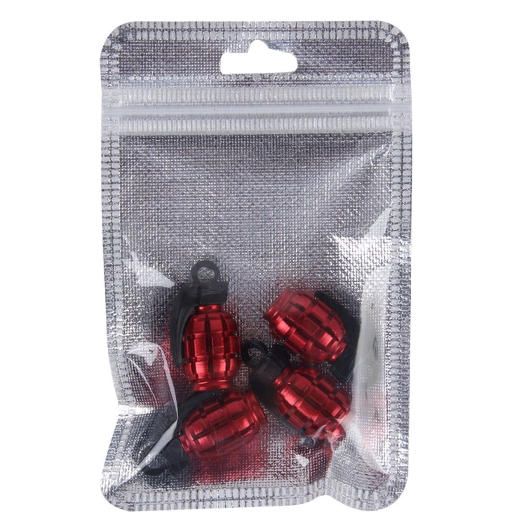 Red grenade-style tire valve caps in sealed blister pack, multiple pieces shown