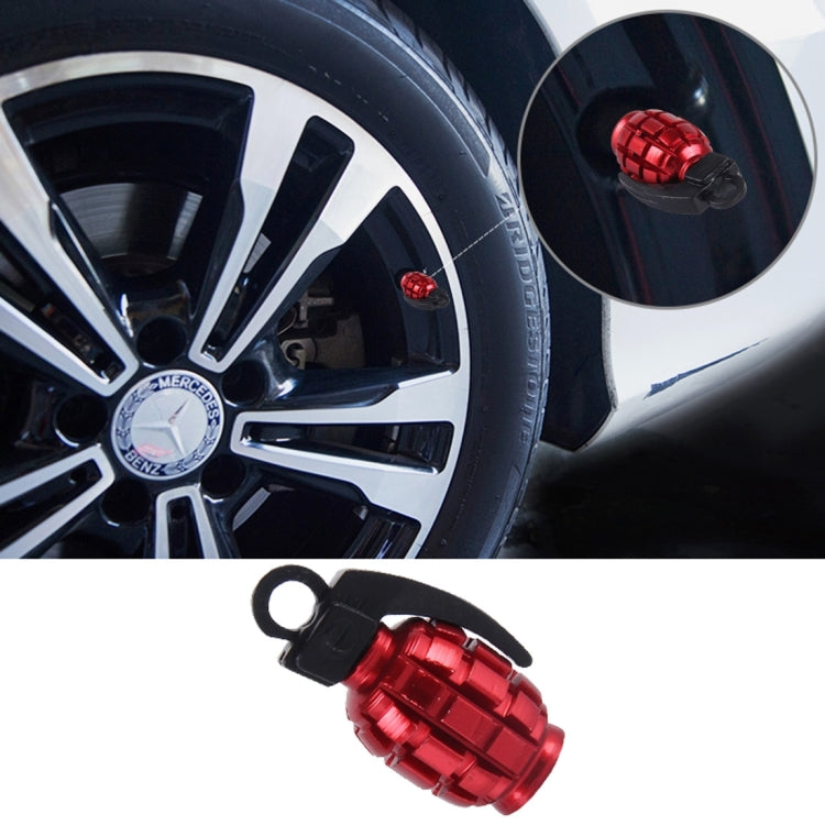 Red grenade-style tire valve cap with black loop and black rubber key ring