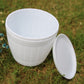 White plastic flower pot with side opening and matching lid-style tray