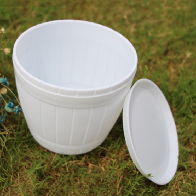 White plastic flower pot with side opening and matching lid-style tray