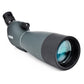 Teal monocular telescope close-up showing front lens with blue-green glass.