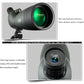 Monocular telescope lens close-up with green-tinted optics on tripod base.
