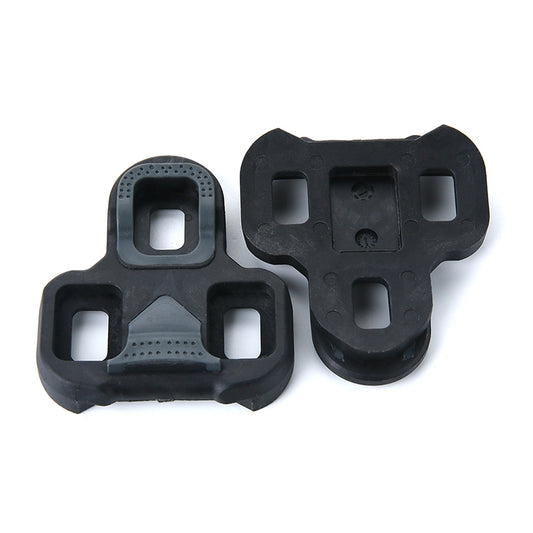 Black road bike pedal cleats, front and back view, with textured contact surfaces