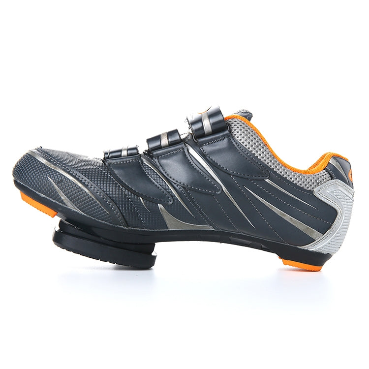 Cycling shoe with black cleat cover on the sole, orange accent details