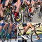 Cyclists riding road bikes wearing cleated cycling shoes with orange details