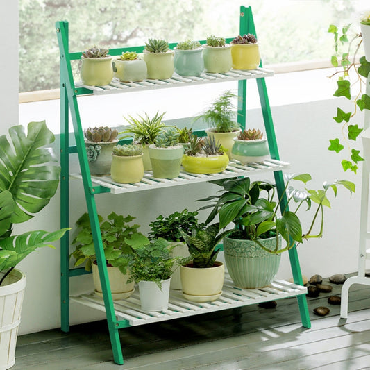 Green bamboo 3-tier plant stand with slatted shelves and potted plants