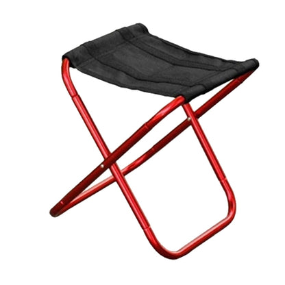 Portable folding stool with red metal frame and black fabric seat.