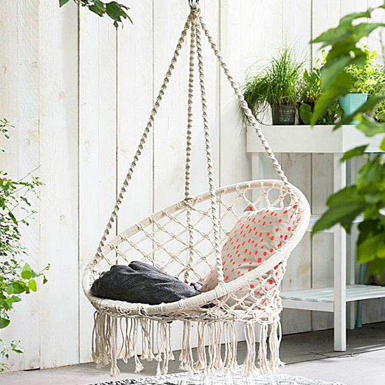 Natural rope woven hanging swing chair with oval net seat and tassel fringe