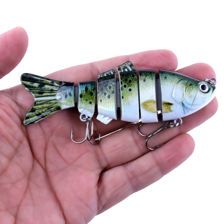 Handheld multi-section hard plastic fishing lure, green speckle pattern with treble hooks