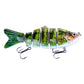 Multi-section hard plastic fishing lure, green patterned body with red accents and treble hooks