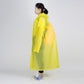 Side view of yellow transparent raincoat with hood and long sleeves