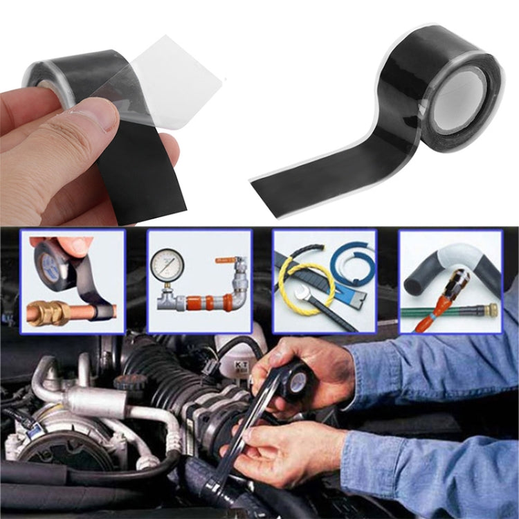 Black silicone self-adhesive tape being pressed onto equipment by hand