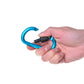 Hand holding a blue D-ring carabiner buckle lock with black textured grip
