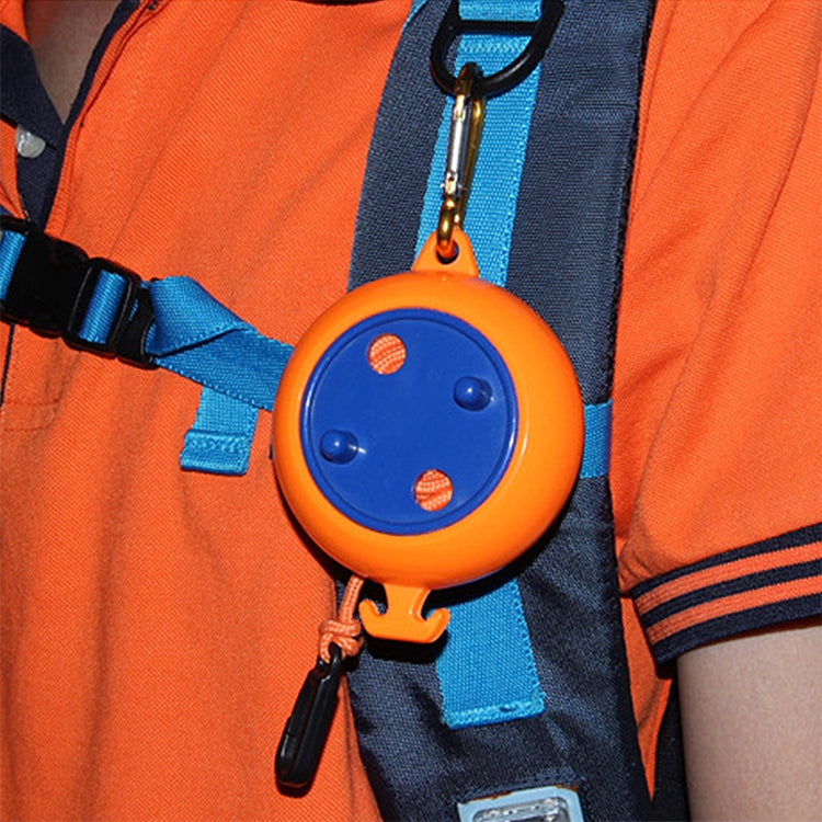 Orange and blue retractable clothesline reel clipped to a backpack strap