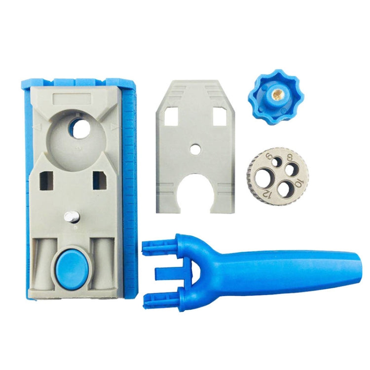 Woodworking borehole locator jig with blue handle, gray base, and circular measuring dial