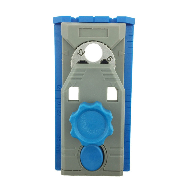 Woodworking borehole locator jig with gray frame, blue side guides, and numbered ring