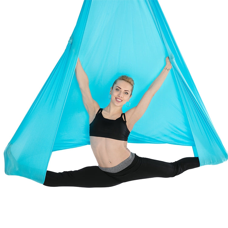 Light blue aerial yoga hammock with top ropes and spread fabric for poses
