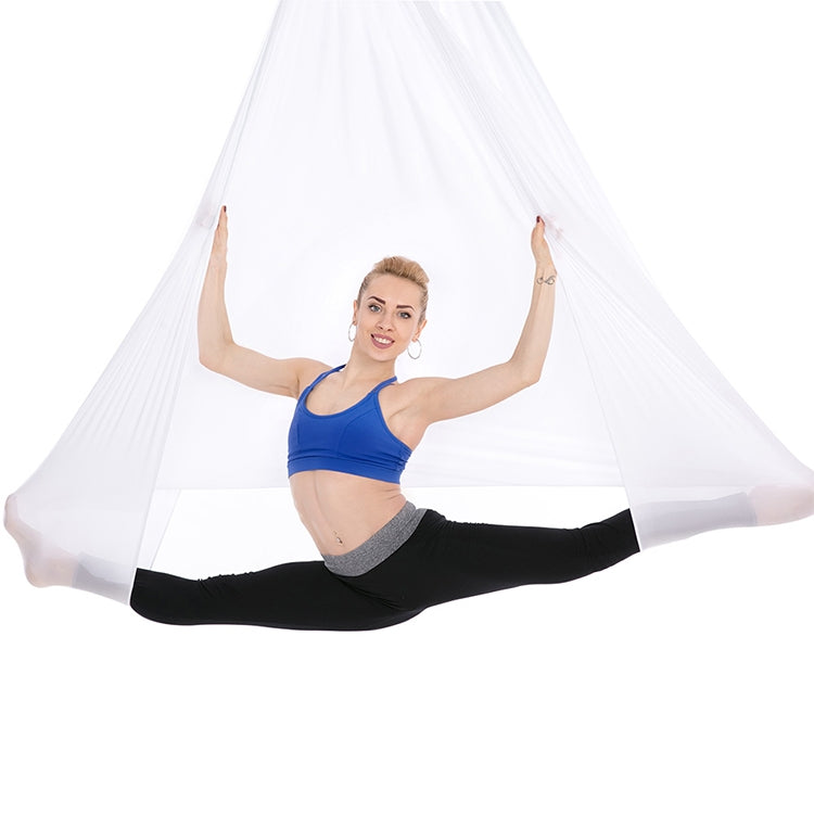 White aerial yoga hammock with mesh fabric, person doing a stretching pose