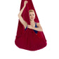 Wine red aerial yoga hammock with gathered mesh canopy, person holding straps