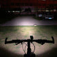 Front bicycle LED light casting a wide beam on the ground in low light