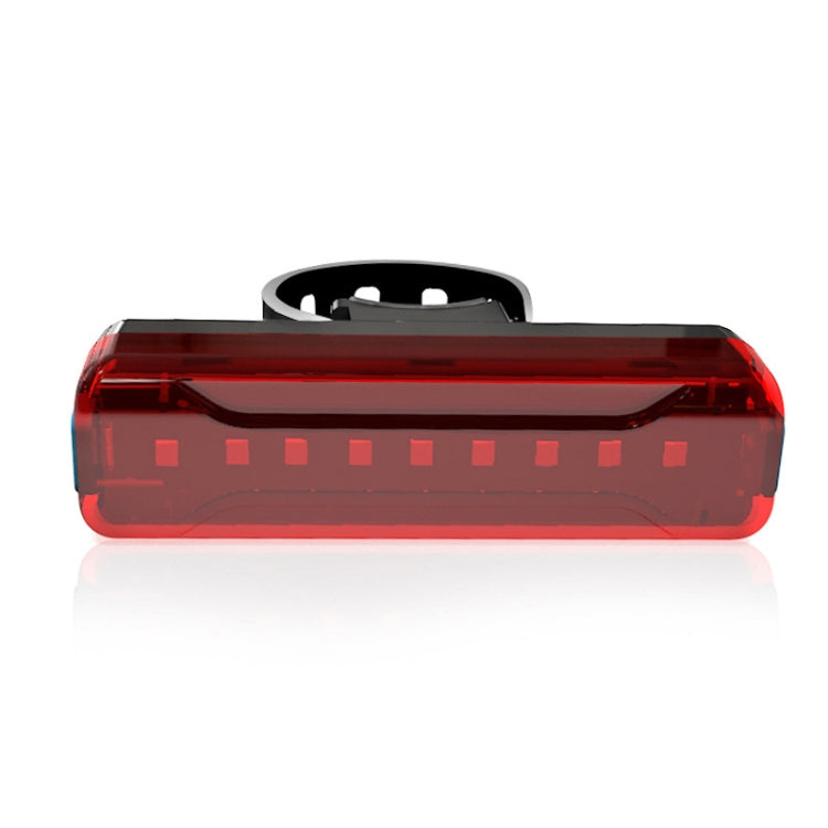 Red rear bicycle LED light with integrated lens, black mounting top