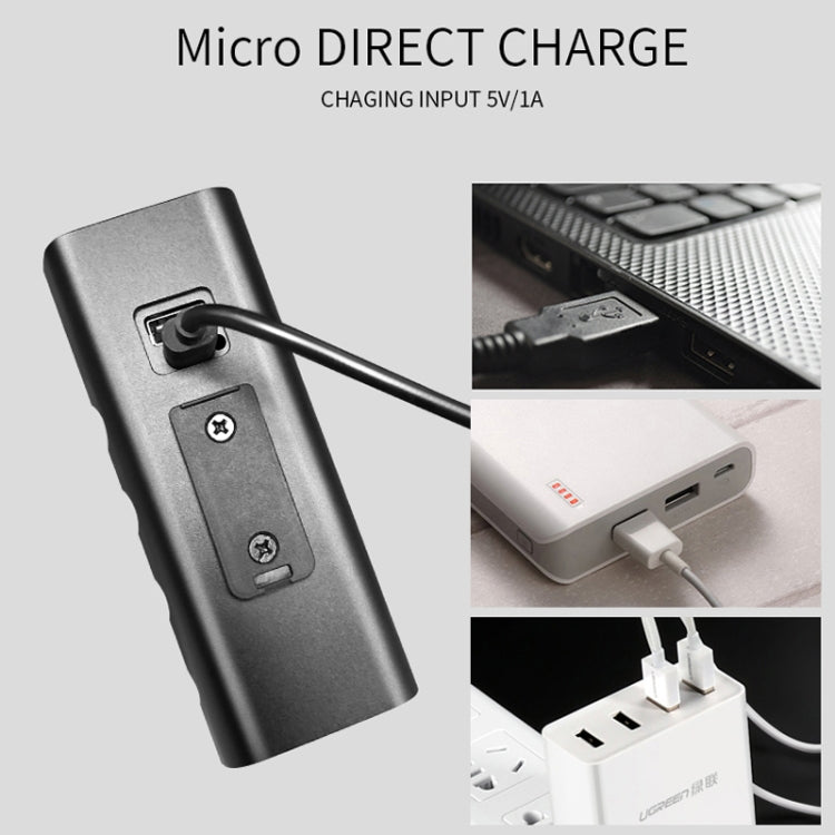 Bicycle light with micro USB charging input and connected cable, close-up