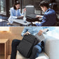 Dark gray laptop backpack worn on back with front zipper closure