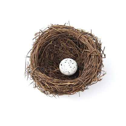 Simulated bird nest decoration with one white speckled egg