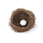 Simulated bird nest decoration with one white speckled egg, brown woven nest
