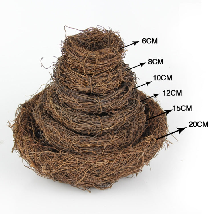 Brown woven bird nest decoration with white arrows marking dimensions