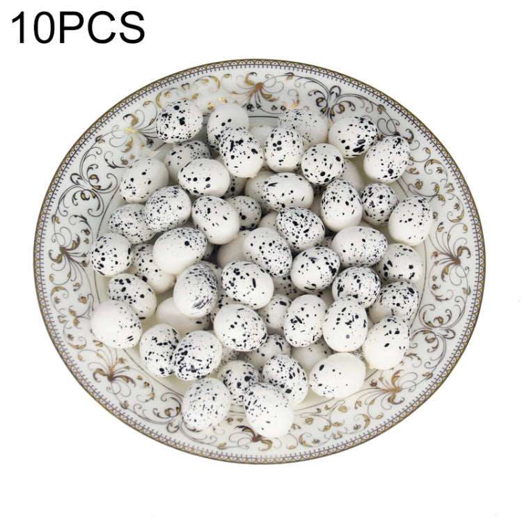 Simulated bird eggs set, white with black speckles, in decorative serving dish