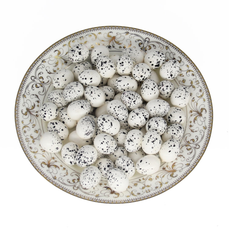 Simulated bird eggs, white speckled eggs arranged in patterned ceramic dish