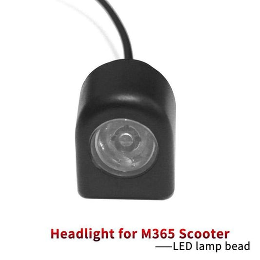 Black LED headlight with clear round lens and hanging cable
