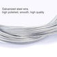 Close-up of polished galvanized steel bicycle inner cable wire, smooth and shiny