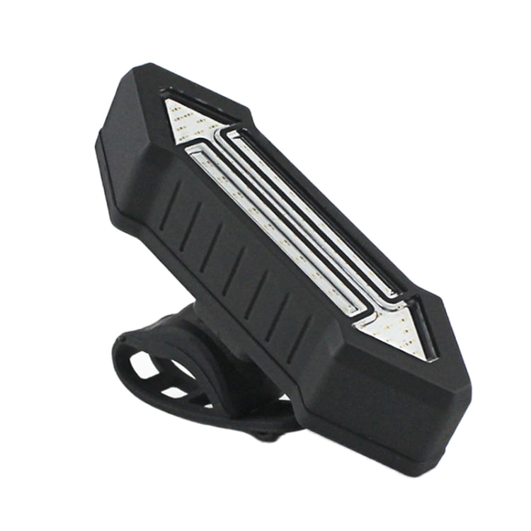 Black bike tail light unit with clear internal LED lens and arrow-style reflector panels